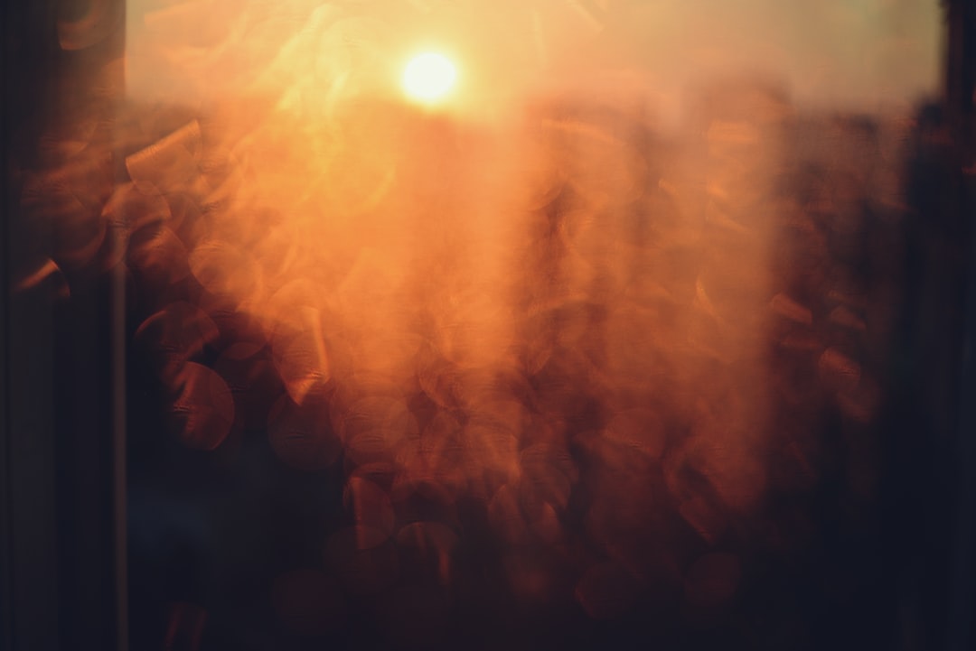 Sunset through a rain-streaked window.