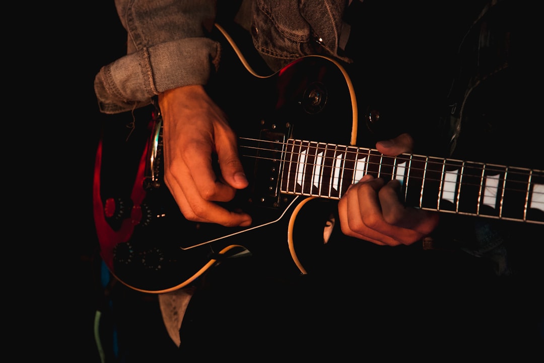 a person playing a guitar