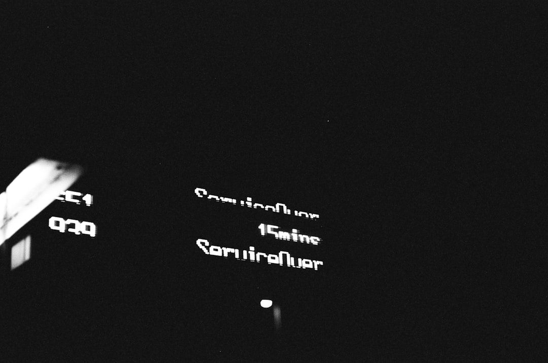 a black and white photo of a street sign