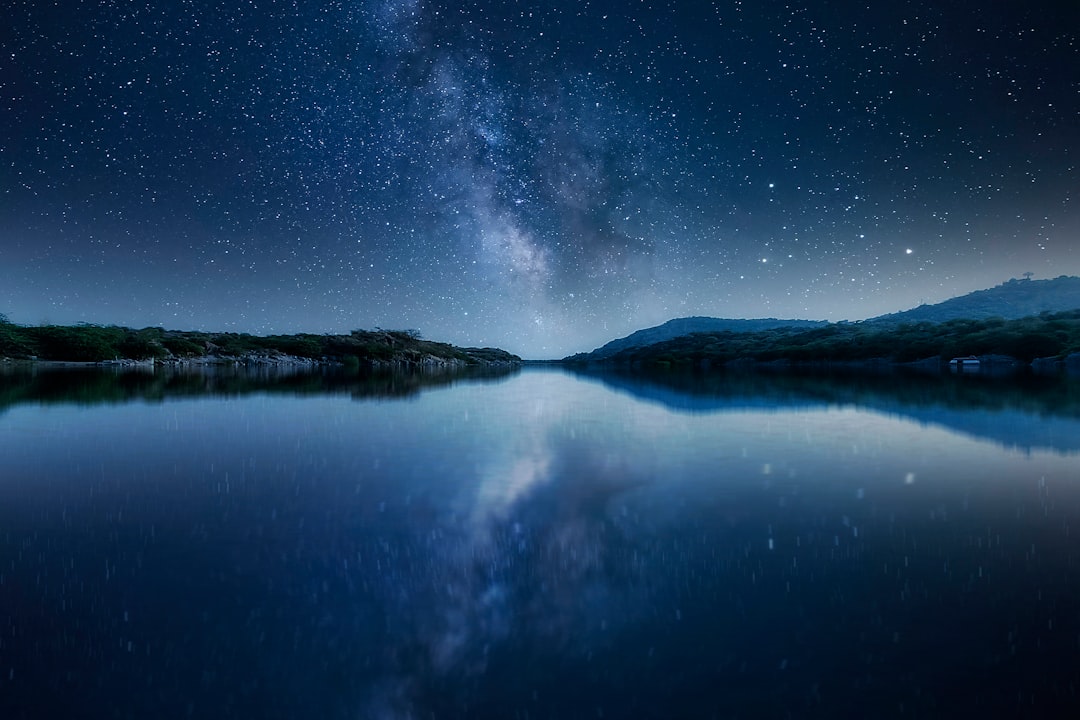 body of water under starry night